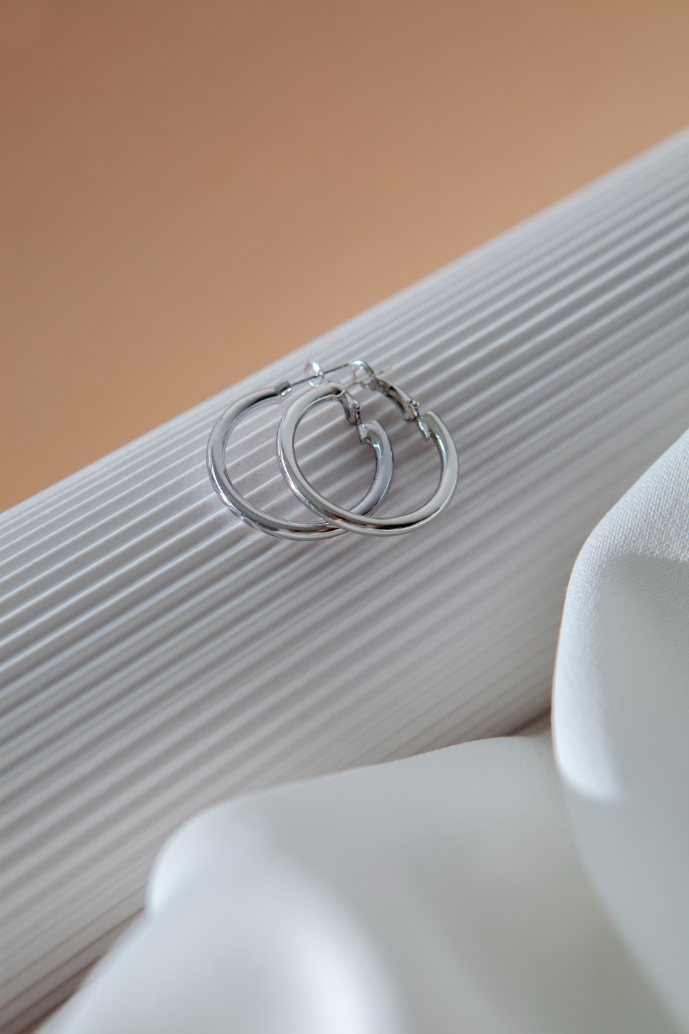 aesthetic-silver-earrings-arrangement